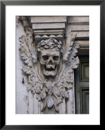 Stone Carving Of A Laurel Leaf Encircled Human Skull On A Pilaster by Stephen Alvarez Pricing Limited Edition Print image