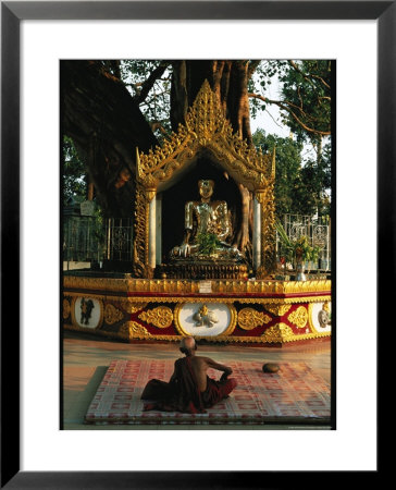 Buddhist Monk Meditating Near Altar With Buddha Statue And Gilt by Steve Winter Pricing Limited Edition Print image