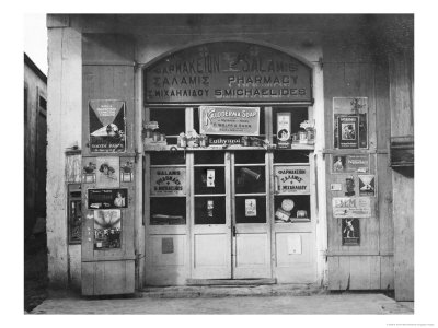 View Of The Front Of A Neighborhood Drugstore In Cyprus by W. Robert Moore Pricing Limited Edition Print image