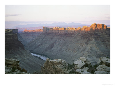 Colorado River Runs Through Cataract Canyon As The Sun Hits Its Crest by Skip Brown Pricing Limited Edition Print image