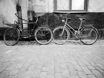 Two Bicycles In Street by Alex Holland Pricing Limited Edition Print image