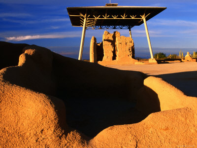 Shelter Over Ruin With Shadowed Rocks In Foreground, Casa Grande Ruins National Monument, Arizona by Eddie Brady Pricing Limited Edition Print image