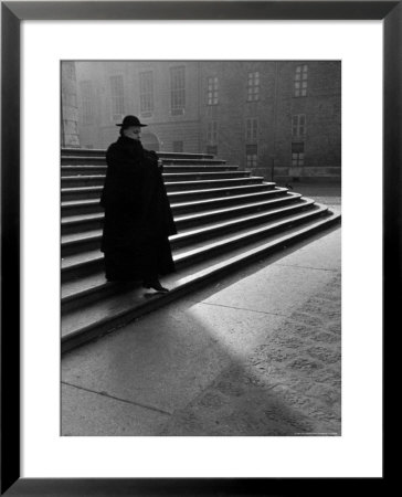 Italian Catholic Priest Majestically Descending Stairs by Alfred Eisenstaedt Pricing Limited Edition Print image