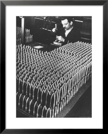 Rows Of 15 Cm Shells On Table Where Worker Uses Hammer And Stamping Tool At Skoda Munitions Factory by Margaret Bourke-White Pricing Limited Edition Print image