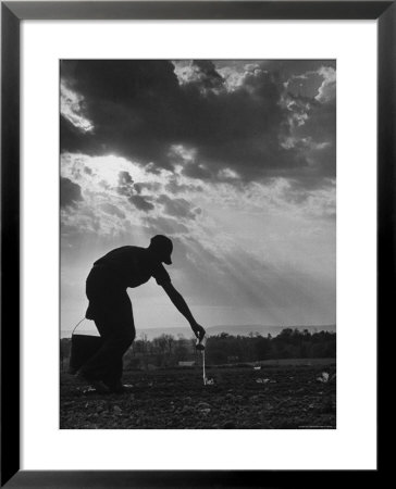 Farmer Watering The Crops by Ed Clark Pricing Limited Edition Print image