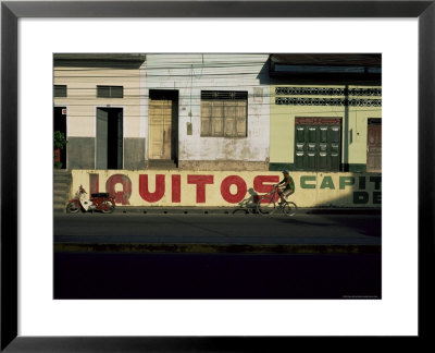 Bicycle Cruises Past Homes, Iquitos, Peru, South America by Aaron Mccoy Pricing Limited Edition Print image