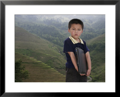 Boy Of Yao Mountain Tribe Minority With Laptop, China by Angelo Cavalli Pricing Limited Edition Print image