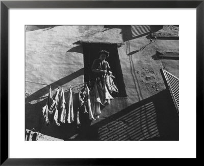 Woman Hanging The Laundry Out To Dry by Vincenzo Balocchi Pricing Limited Edition Print image