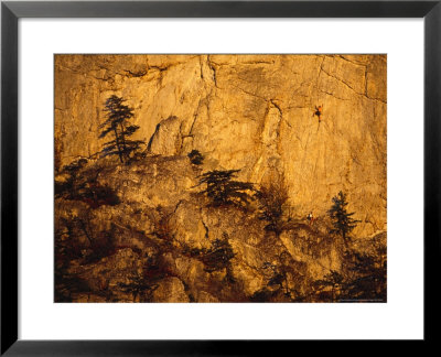 Rock Climbers On Seneca Rocks At Sunset by Raymond Gehman Pricing Limited Edition Print image