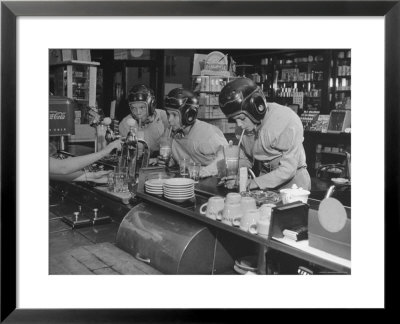 Teammates Little Golds Football Having Soda At Robertson's Drugstore by Francis Miller Pricing Limited Edition Print image