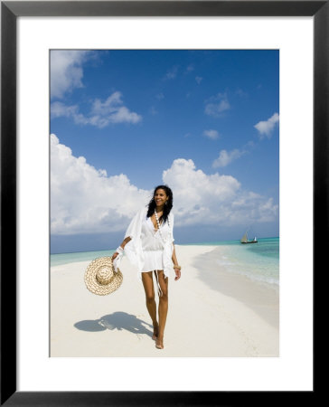 Young Woman Walking On Kuramathi Sandbank, Rashdoo Atoll, Alifu, Maldives by Felix Hug Pricing Limited Edition Print image