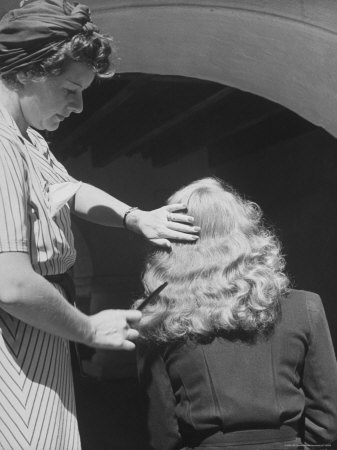 Actress Bette Davis Having Hair Fixed By Stylist Margaret Donovan Of Warner Bros. Studio by Alfred Eisenstaedt Pricing Limited Edition Print image