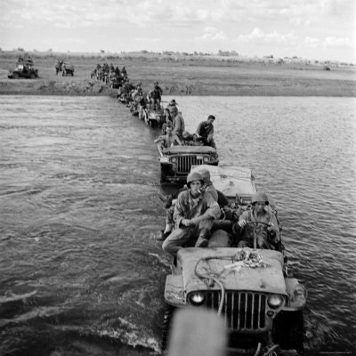 American Jeeps Being Towed Across The Panpanga River By Tractor During The Drive Towards Manila by Carl Mydans Pricing Limited Edition Print image