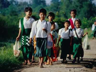 Young Girls On The Way To School, Nyaungshwe, Shan State, Myanmar (Burma) by Bernard Napthine Pricing Limited Edition Print image