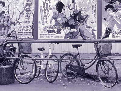 Bicycles In Front Of Film Poster, Japan by Walter Bibikow Pricing Limited Edition Print image