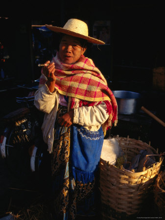 An Elderly Woman Smoking On A Cheroot At The Market, Pyin U Lwin, Myanmar (Burma) by Juliet Coombe Pricing Limited Edition Print image