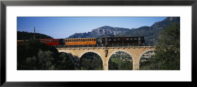 Train Crossing A Bridge, Sierra De Tramuntana, Majorca, Spain by Panoramic Images Pricing Limited Edition Print image