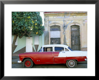 Old American Car Parked On Street Beneath Fruit Tree, Cienfuegos, Cuba, Central America by Lee Frost Pricing Limited Edition Print image