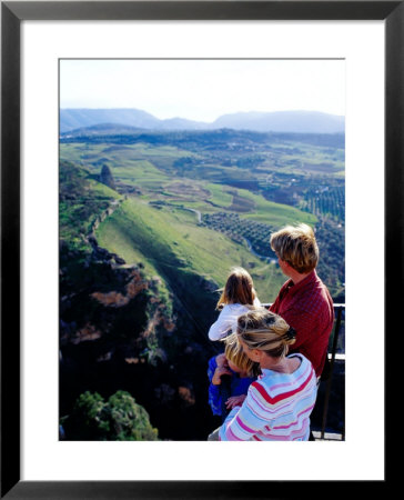 Family Looking At Countryside From Lookout, Ronda, Spain by Philip & Karen Smith Pricing Limited Edition Print image
