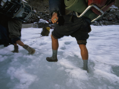 Local People Crossing The Ice Covered Zanskar River Wearing Socks by Steve Winter Pricing Limited Edition Print image