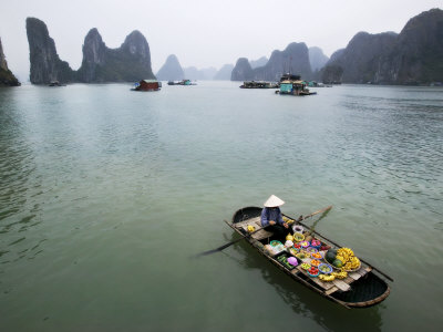 Boat Woman Selling Fruit In Halong Bay, Vietnam by Scott Stulberg Pricing Limited Edition Print image