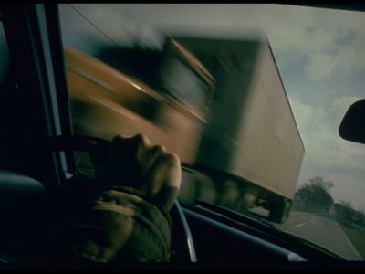 Blurred Oncoming Truck Passing, Visible Through Windshield Of Car; Dangerous Stretch Of Highway 20 by Ralph Crane Pricing Limited Edition Print image