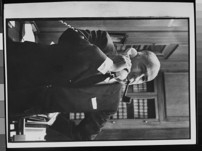 Us Attorney General John Mitchell With Pipe Clenched In His Teeth, Talking On The Telephone by Alfred Eisenstaedt Pricing Limited Edition Print image