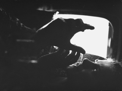 Dancer Karin Von Aroldingen Listening To Ballet Master George Balanchine During Flight by Gjon Mili Pricing Limited Edition Print image