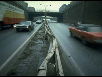 Twisted Guardrail Evidencing Prior Accident On Walled-In Corridor On Interstate 95 by Ralph Crane Pricing Limited Edition Print image