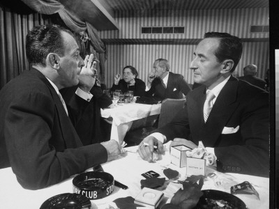 Playwright Moss Hart Chatting With Columnist Leonard Lyons In The Stork Club by Gjon Mili Pricing Limited Edition Print image