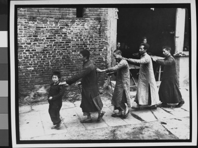 Small Boy Leading Chain Of Four Blind Men Through Street During Famine by George Silk Pricing Limited Edition Print image