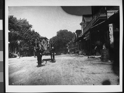 A Black Man Driving A Cart Pulled By Three Mules Down Main St by Wallace G. Levison Pricing Limited Edition Print image