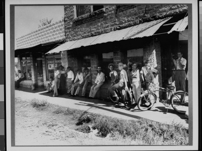 Children And Adults Lined Up In Front Of Post Office Waiting For Mail by Russell Lee Pricing Limited Edition Print image