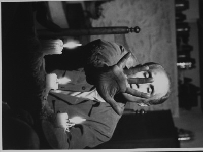 Dancer Jose Limon Seated At Candle Lit Table At His Home by Gjon Mili Pricing Limited Edition Print image