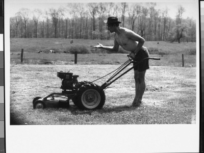 Dancer Jose Limon Clowning With Lawnmower At His Home by Gjon Mili Pricing Limited Edition Print image