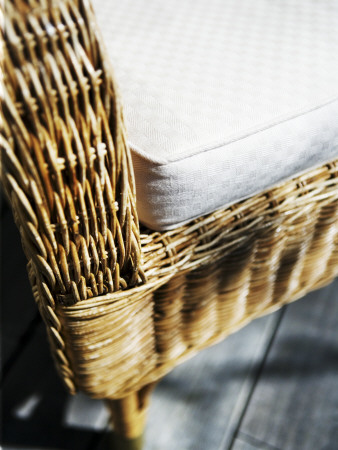 A Wicker Chair With A Cushion by Gunnar Svanberg Skulasson Pricing Limited Edition Print image
