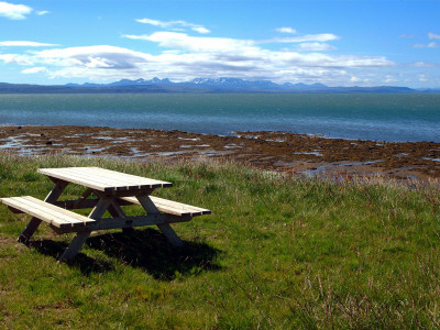 A Table With Attached Benches, Near A Seashore by Inger Helene Boasson Pricing Limited Edition Print image