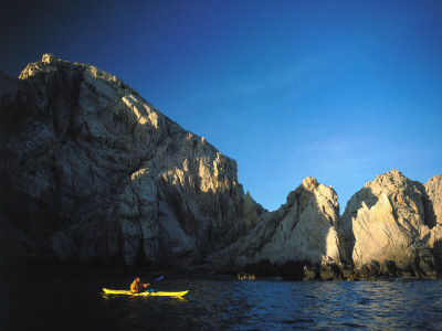 Sea Kayaker Passes Sea Stacks By Cabo San Lucas by Jeff Foott Pricing Limited Edition Print image