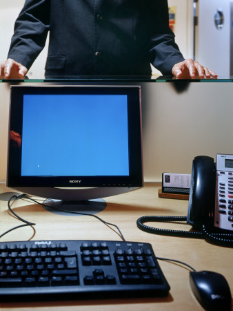 Office Life And Interiors, Detail Of Reception Desk And Man Waiting by David Churchill Pricing Limited Edition Print image