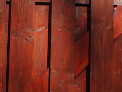 Backgrounds - Detail Of Red Stained Elaborate Timber Fence Panel by Natalie Tepper Pricing Limited Edition Print image