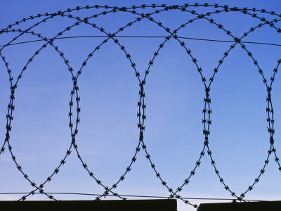 Razor Wire Surrounding The Gasometers, Loops Of Wire by Philippa Lewis Pricing Limited Edition Print image