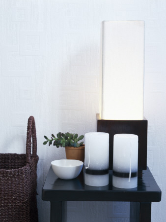 Cool White Table With Vases, Succulent, Bowl And Lamp Beside Wicker Basket by Richard Powers Pricing Limited Edition Print image