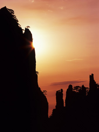 Sunburst On Craggy Huangshan Peaks, Anhui, China by Charles Crust Pricing Limited Edition Print image