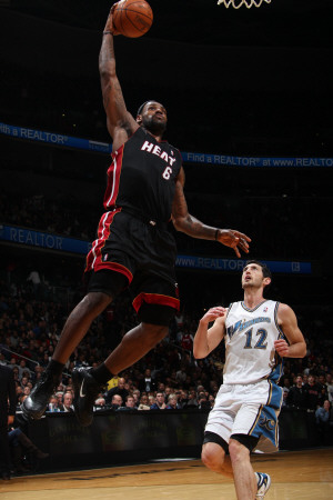 Miami Heat V Washington Wizards: Lebron James And Kirk Hinrich by Ned Dishman Pricing Limited Edition Print image