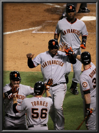 Texas Rangers V. San Francisco Giants, Game 5:  Cody Ross, Juan Uribe, Edgar Rentaria, Aaron Rowand by Stephen Dunn Pricing Limited Edition Print image