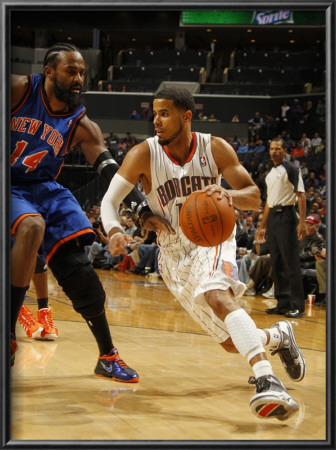 New York Knicks V Charlotte Bobcats: D.J. Augustin And Ronny Turiaf by Kent Smith Pricing Limited Edition Print image