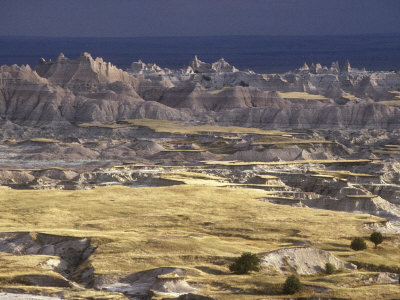 View Of The Badlands Silhouetted Against A Gray Sky by Stephen Sharnoff Pricing Limited Edition Print image