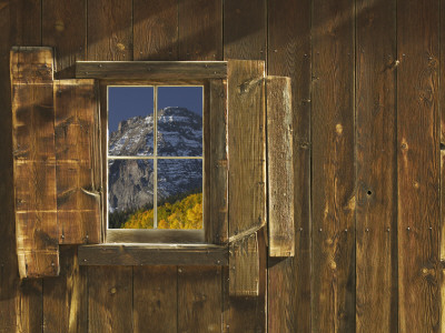 Reflection Of Mountain And Forest In Window Of Old Cabin, Uncompahgre National Forest, Colorado by Jeff Vanuga Pricing Limited Edition Print image