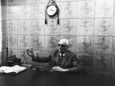Enzo Ferrari In His Office In Modena, Italy, 1985 by Benno Graziani Pricing Limited Edition Print image
