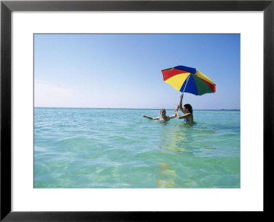 Young Women In Ocean With Umbrella by Mark Gibson Pricing Limited Edition Print image